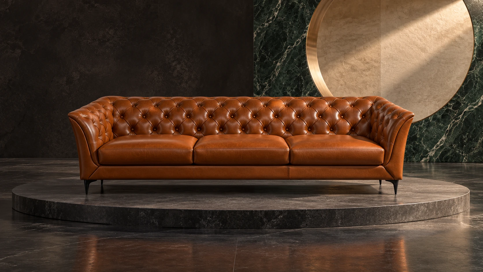 Kingston cognac leather sofa on a sculptural stone stage with green marble and a bronze-edged circular opening